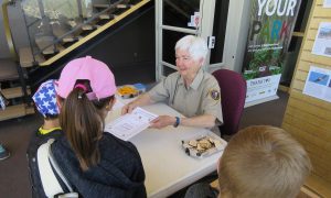 Volunteer Marilane Jones swears in new Junior Rangers at Walnut Canyon National Monument | NPS Photo