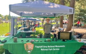 Ranger Mark Szydio mans booth for Flagstaff National Monuments | NPS Photo