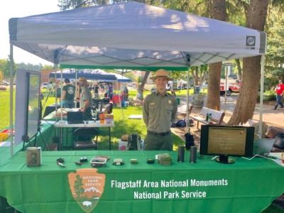 Ranger Mark Szydio mans booth for Flagstaff National Monuments | NPS Photo